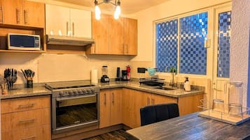 Fridge, microwave, oven, cookware/dishes/utensils