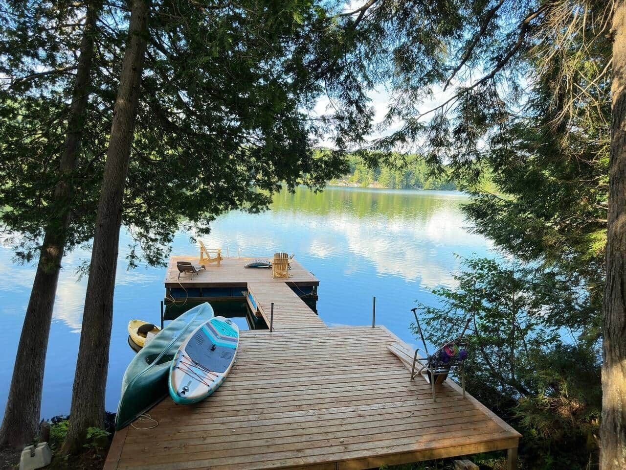 Kayak, canoe and stand-up paddle board are ready to be taken out onto the water
