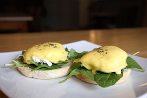 Two eggs benedict sandwiches on a white plate. - Olde Kings Arms (Hemel Hempstead)