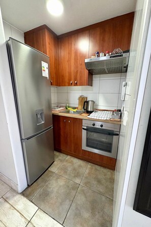 Fridge, microwave, oven, cookware/dishes/utensils - Gemütliche Wohnung in Santiago by Interhome (Santiago de Chile)