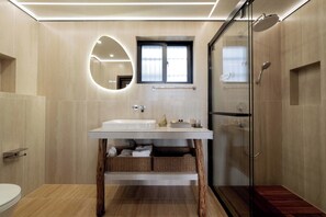 A modern bathroom with a large sink, a glass shower enclosure, and a wooden vanity. - Dali Fanshe Tea Garden Inn (Dali)