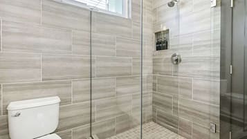 Shower, hair dryer, towels, shampoo