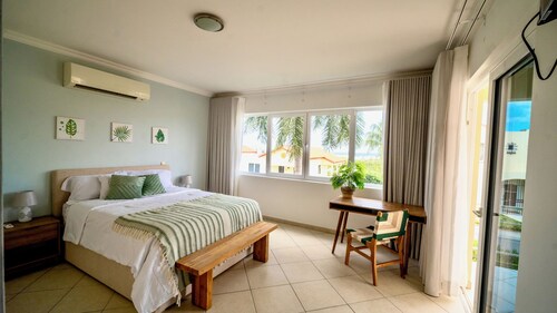 Spacious condo at gated resort-Walk to the Beach