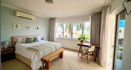 Spacious condo at gated resort-Walk to the Beach