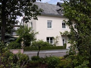 A two-story house with a white facade, multiple windows, and a small front garden. - Auszeit Trittenheim by Interhome (Trittenheim)