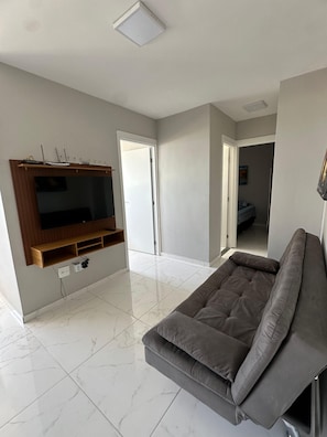 Apartamento família, varanda, vista para o mar | Área de estar