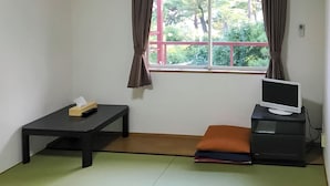 A room with a tatami mat floor, a desk with a computer, a small table with a tissue box, and a window with curtains. - B B Dylan (Otsu)