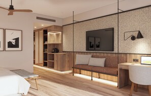 Une chambre moderne avec un lit, un bureau, un canapé et un téléviseur.
