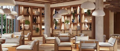 A modern lounge area with wooden furniture, pendant lighting, and a variety of decorative items on shelves.