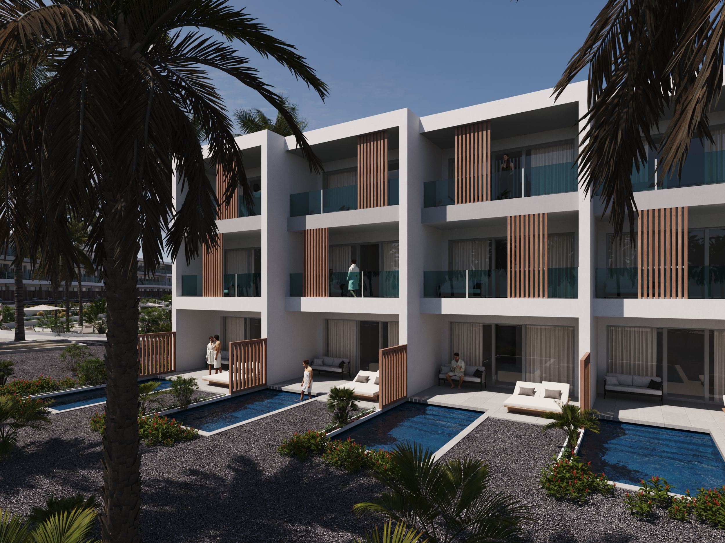 Un hôtel moderne à plusieurs étages, doté de balcons, de piscines extérieures et de palmiers.