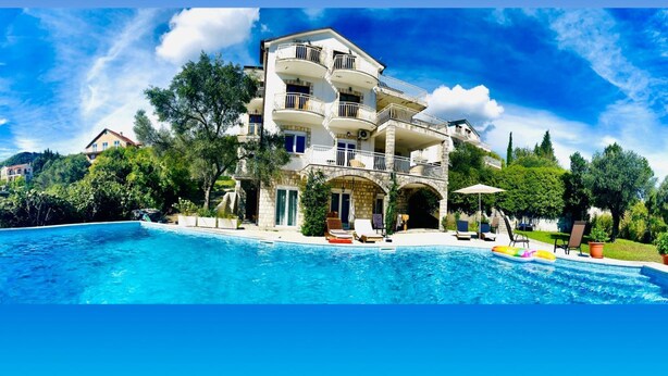 A multi-story building with a pool in front. - Appartement mit Pool by Interhome (Herceg Novi)