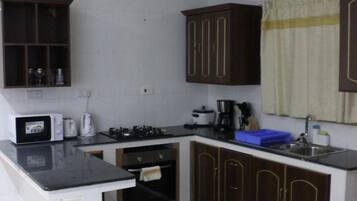 Fridge, microwave, oven, cookware/dishes/utensils