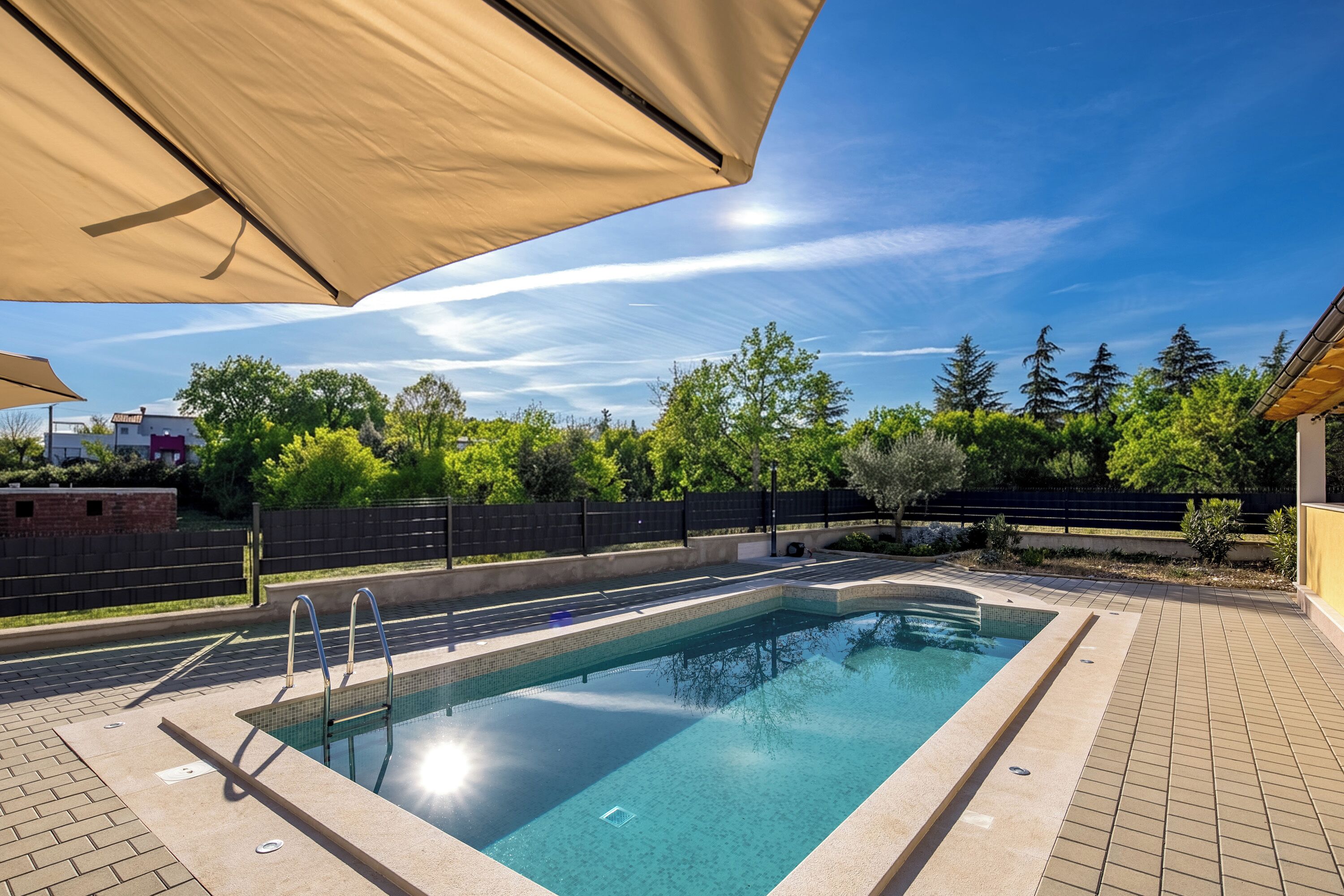 Seasonal outdoor pool, a heated pool
