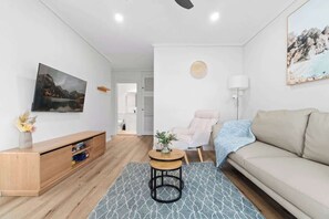 TV, offices - Coastal Bliss: 2BR Apartment in Glenelg (Glenelg South)