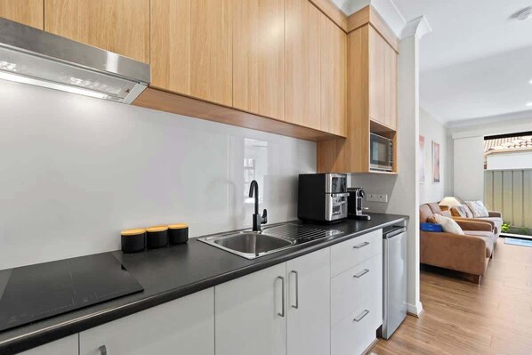 Microwave, stovetop, coffee/tea maker, toaster