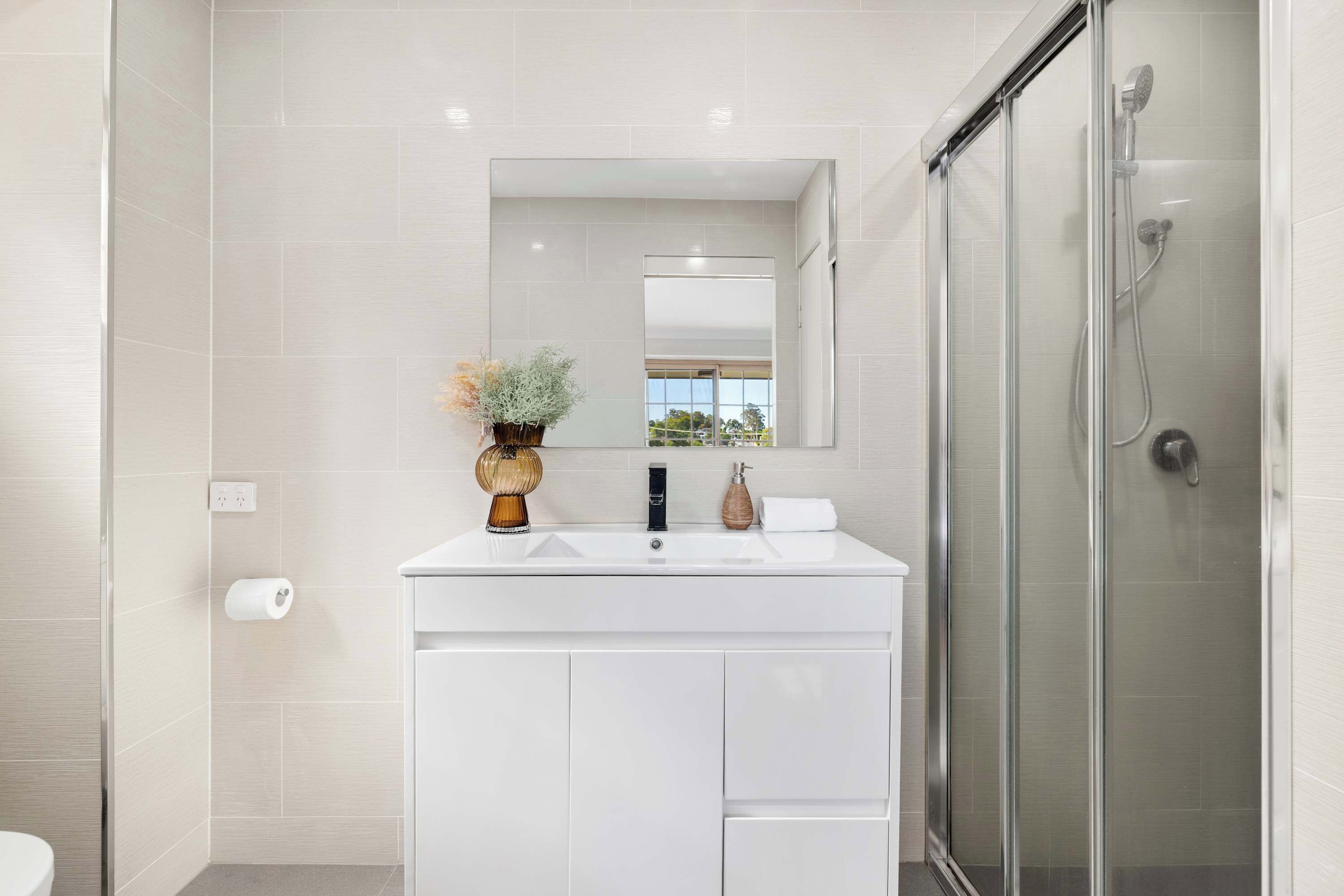 Shower, hair dryer, towels, shampoo