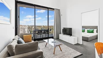 Apartamento Deluxe, balcón, vistas a la ciudad | Zona de estar