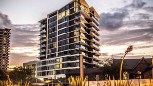 A multi-story hotel with balconies, large windows, and a modern architectural design. - High Street Apartments Toowong (brisbane)