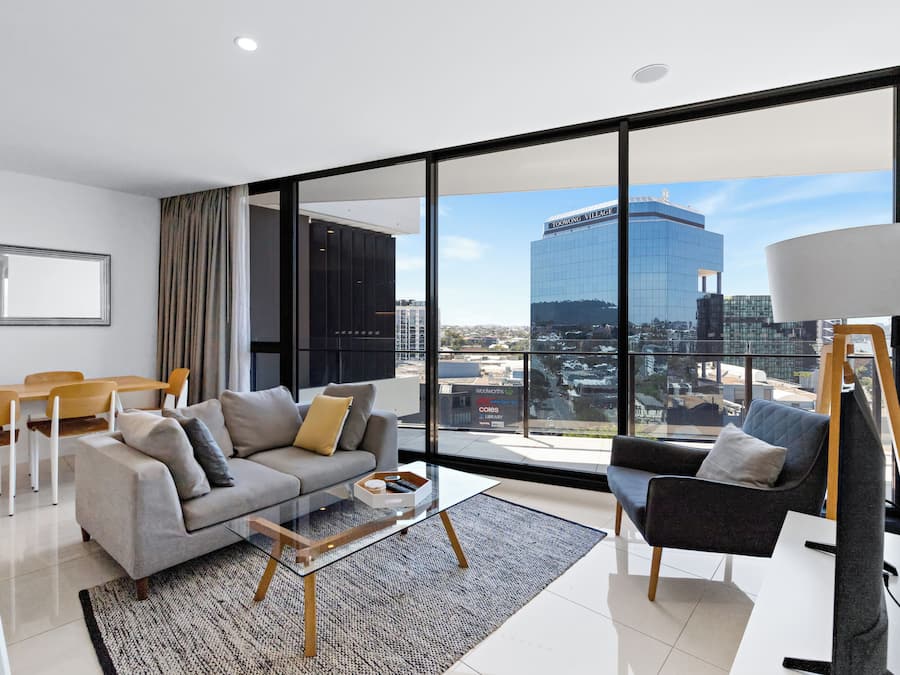 Deluxe Apartment, Balcony, City View | Living area | TV