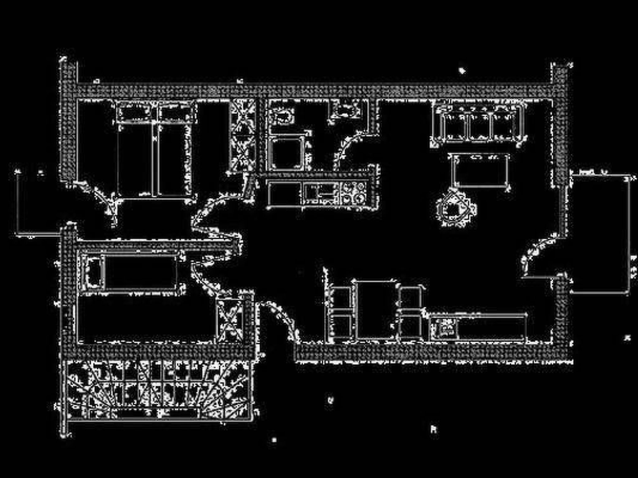 Un plan d’étage comprenant plusieurs pièces, notamment un grand espace central qui pourrait servir de hall d’entrée ou d’espace commun, ainsi que plusieurs pièces plus petites, probablement destinées à être des chambres, et une cuisine.