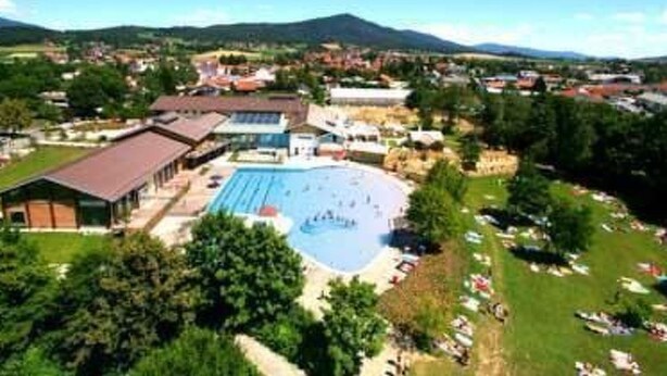 An aerial view of a resort with a large swimming pool, multiple buildings, and surrounding greenery. - Ferienresidenz Am weißen Regen by Interhome (Bad Kötzting)