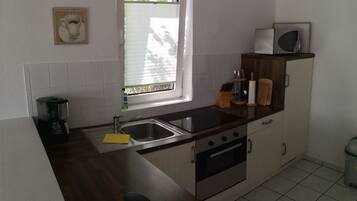 Fridge, microwave, oven, cookware/dishes/utensils