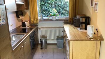 Fridge, microwave, oven, cookware/dishes/utensils