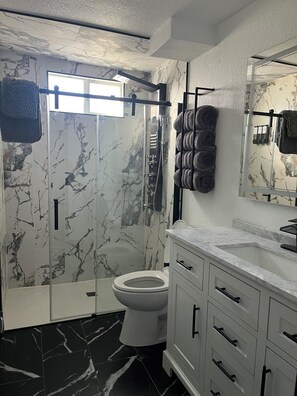 Shower, hair dryer, towels, soap