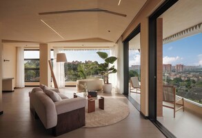 Luxury Double Room, Patio, City View | Living area | TV