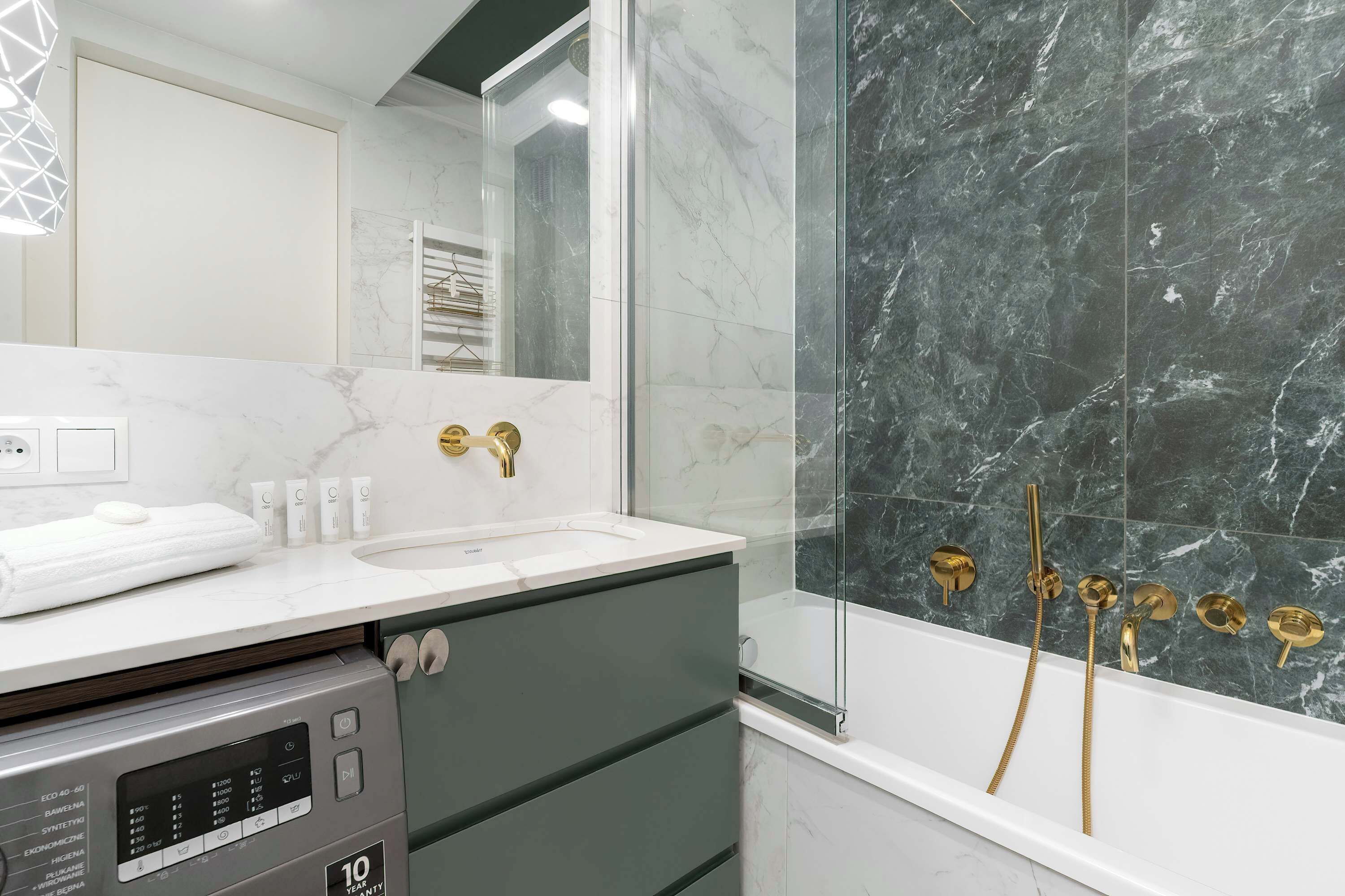Shower, hair dryer, towels, shampoo