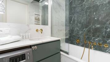 Shower, hair dryer, towels, shampoo