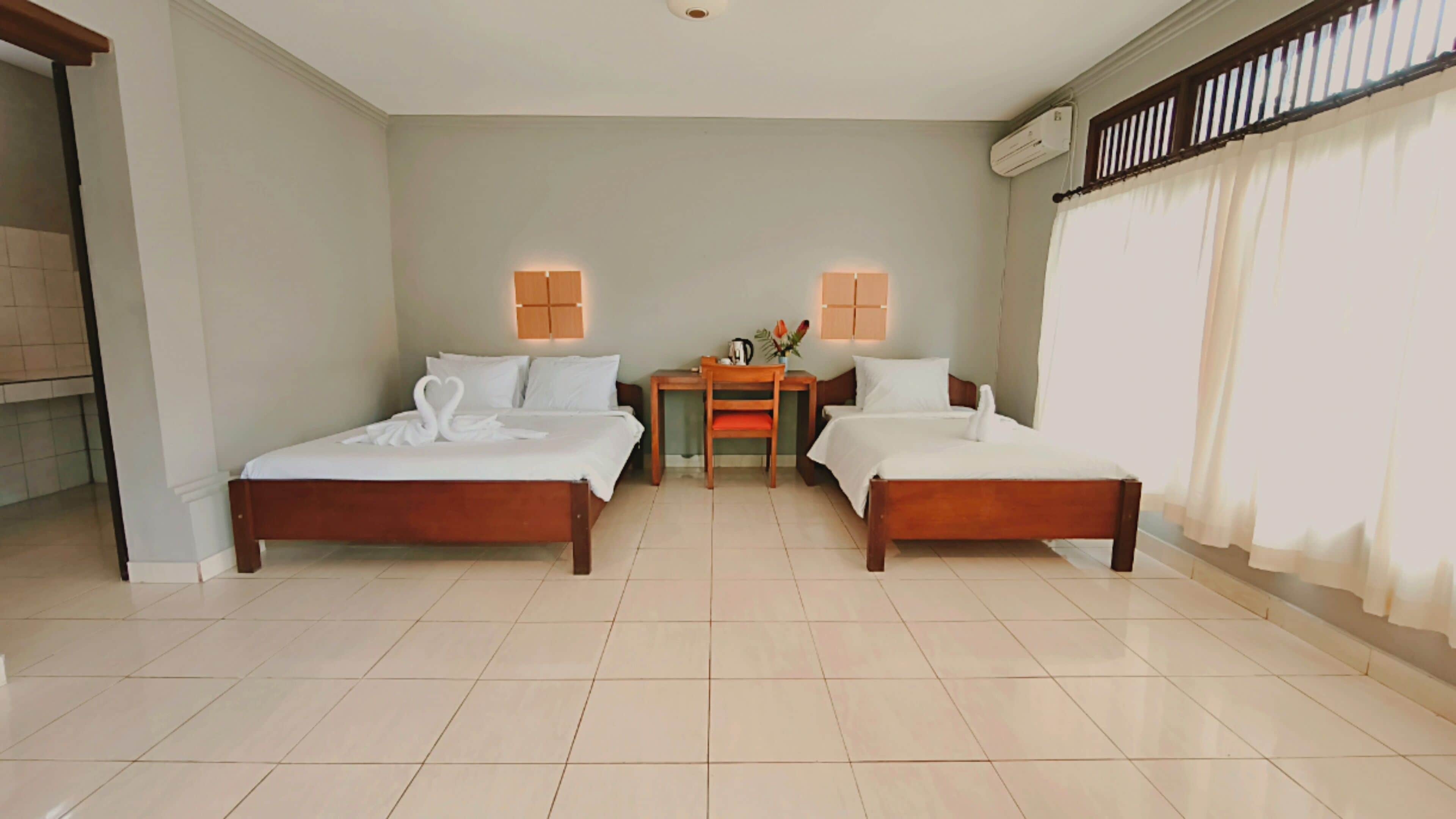 Family Triple Room, Garden View | In-room safe, desk, laptop workspace, free WiFi