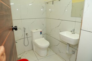 Deluxe Double Room, City View | Bathroom | Shower, free toiletries, towels - SJ HOMES  (Karukachal)