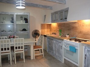 Fridge, oven, cookware/dishes/utensils