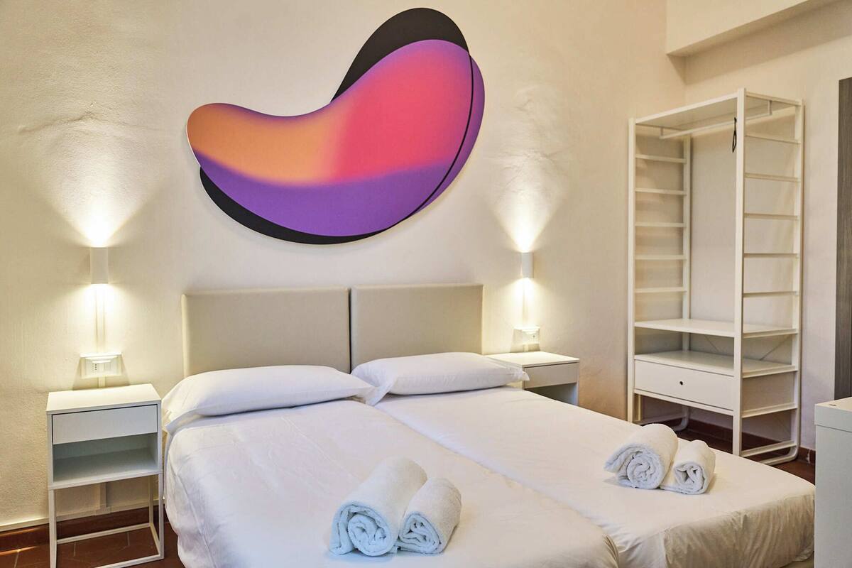 Habitación clásica con 1 cama doble o 2 individuales, vistas a la ciudad | Wifi gratis y ropa de cama
