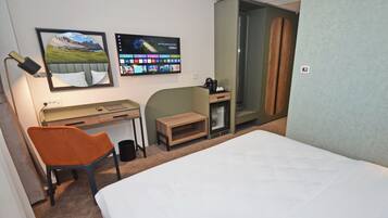 Deluxe Double Room, City View | In-room safe, desk, laptop workspace, blackout drapes