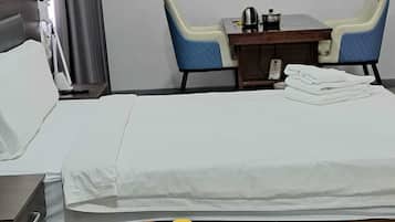 Premium bedding, desk, laptop workspace, free WiFi