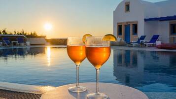 Seasonal outdoor pool, open 11:00 AM to 7:00 PM, pool umbrellas