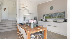 Dining - The 4-person Villa Super VIP features a luxurious and comfortably furnished interior with a direct waterfront location, various terraces offering unobstructed views over the water. (Ouddorp)