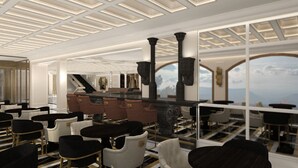 Un interior moderno con una zona de bar, asientos y vistas al exterior.