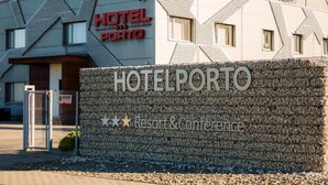 A hotel sign with "HOTEL PORTO" and "Resort & Conference" indicating a hotel with conference facilities. - HOTEL PORTO (Radomsko)
