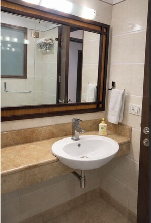Executive Double Room | Bathroom | Shower, free toiletries, towels, soap - EMBLEM - Arjun Marg Golf Course Road (Gurugram)