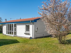A small white house with a red roof, a window, and a door. - "Allyson" -  from the sea by Interhome (Hadsund)