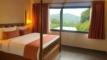 Deluxe Cottage, Garden View | Premium bedding, minibar, in-room safe, desk