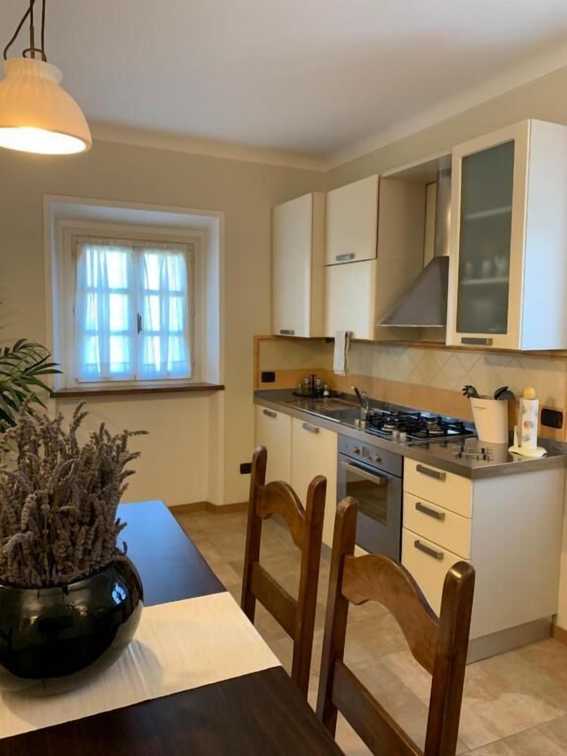 Deluxe Apartment, Kitchen, Garden View | Private kitchen | Shared fridge, microwave, highchair