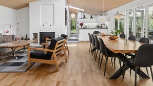 A modern interior with a dining area, kitchen, and living space. - "Aiko" - 1.8km from the sea by Interhome (Højby)