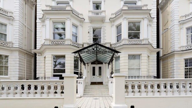 A grand entrance with a symmetrical facade, a central staircase, and a decorative canopy. - Studio Flat With Garden Access, Holland Park (London)