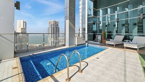 A rooftop pool with a clear view of the city skyline. - Penthouse Private Pool and Yacht Views (Dubai)