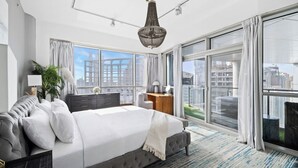 A modern bedroom with a large bed, a desk, and a view of the city through floor-to-ceiling windows. - Penthouse Private Pool and Yacht Views (Dubai)