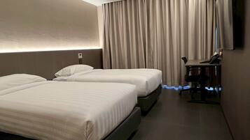 Standard Twin Room, City View | In-room safe, desk, laptop workspace, blackout curtains